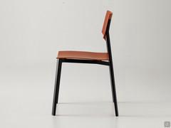 Side view of the Omnia chair in polypropylene, with slightly curved and sloping back to maximise seating comfort