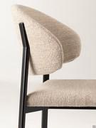 Detail of the Omnia armchair version, with single-colour upholstery in Nocera N002 fabric