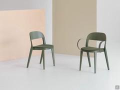 Minima chair with upholstered seat, here in the version with or without burnished brass metal armrests