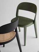 Detail of Minima chairs with cane or upholstered seat covered in fabric