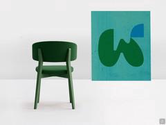 Darcey low chair with curved backrest, wooden structure in green lacquer matched to the fabric cover