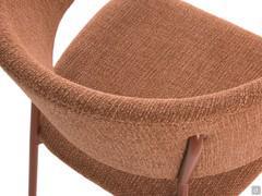 Detail of the curved backrest of Darcey armchair