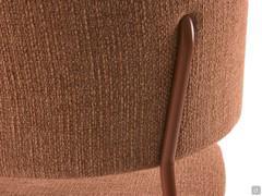 Detail of the tube shaped metal structure fixed to the upholstered backrest