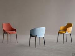 Velis dining chair available in different variants with upholstered body and solid wood frame