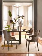 Velis chairs with high back, leather covered body and solid wood frame