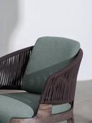 Detail of Velis lounge chair with rope backrest and fabric seat and back cushions