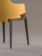 Detail of the workmanship of the upholstered body that engages the solid wood structure