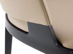 Detail of the connection between upholstered body and solid wood structure