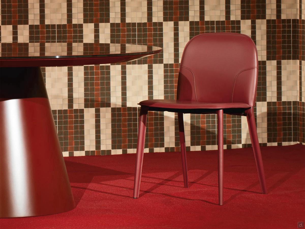 Makalu leather upholstered chair without armrests. Note the delicate relief of the matching stitching