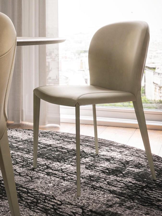 Nancy by Cattelan, an upholstered chair with steel legs covered in fabric, faux leather or leather