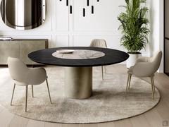 Set of Camille upholstered living room armchairs combined with a round table in a modern and elegant living room