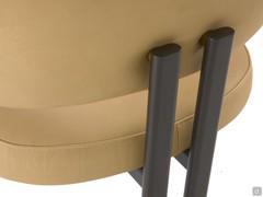 Detail of the vertical metal legs that engage directly on the upholstered backrest