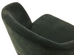 Detail of the curved backrest with side wings embracing the seat