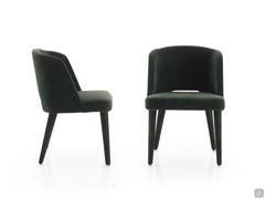 Side and front view of the Dorothy chair highlighting the harmonious and welcoming proportions of the backrest with side wings