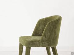 Detail of the shaped upholstered backrest with side wings that accommodate the comfortable seat