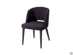 Dorothy armchair here proposed in the version with wooden legs available in wood or RAL lacquered colours