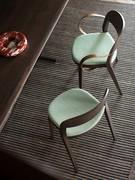 Minima wooden chair with upholstered seat in two versions without and with metal armrests