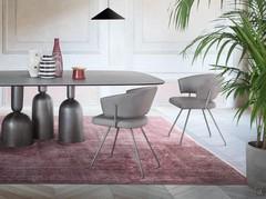 Simple curves and balanced shapes merge elegantly with table forms and finishes