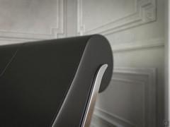 Detail of the curved designer chaise longue Sylvester by Cattelan, with leather upholstery and chrome-plated steel details