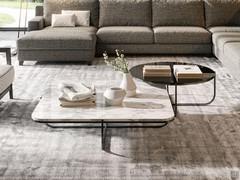 Token Steel coffee tables in round version with glass top and square version with marble top; the tubular metal frame lends itself well to the combination and overlapping of two or more coffee tables