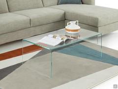 Multiglass coffee table placed in front of the sofa