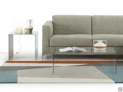 Couple of Multiglass occasional tables, in front and on the side of the sofa