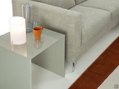 Detail of the square end table, useful as an extra surface next to the sofa