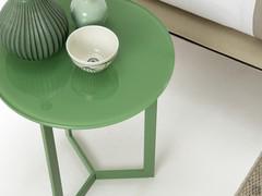 Detail of the side table with green lacquered top and structure