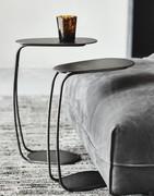 Yago design serving table is very stable and can be used to hold drinks by a sofa