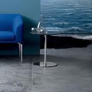 Alias is a contract end table in a round shape with chrome metal base. Here with grey laminate HPL top