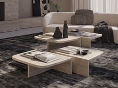 Coffee table composition Auri in travertine marble in two of three available sizes. The models can be freely juxtaposed with each other to create a unique custom complement