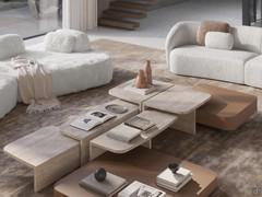 Travertine marble Auri coffee tables in the three available sizes combined with matte lacquered Token coffee tables, one of the endless compositional possibilities