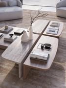 Coffee table Auri 120 cm in two versions in travertine marble and canaletto walnut