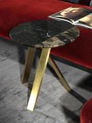 Round Lionel coffee table with metal legs in the Satin Brass finish and marble top in Marquinia Black / Cappuccino