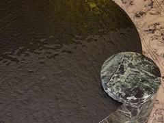 Detail of the hammered glass top and the cylinder in Verde Alpi marble, two features that make Piece a highly refined coffee table