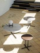 Three round Graphic coffee tables offered with solid wood or marble tops