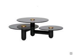 Cosmo coffee table with three tops featuring: black ashwood frame, clear smoked glass tops and a matte gold metal lacquered metal central button.