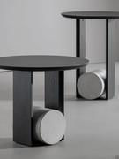 Element coffee table in charcoal brushed wood combination with gray concrete base