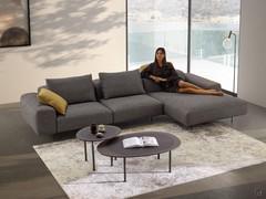 Tobi irregular coffee table with a glass top paired with the Biarritz sofa, for a living room characterised by organic forms