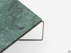 Details of the Guatemala Green marble top nestled into the tubular metal structure