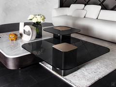 Token coffee tables in two different versions: one in tinged oak with Carrara white marble, the other two with smoked glass and central insert in polished brass