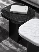 Details of the marble tops and small end table, available in the two finishes Carrara white and Marquinia black