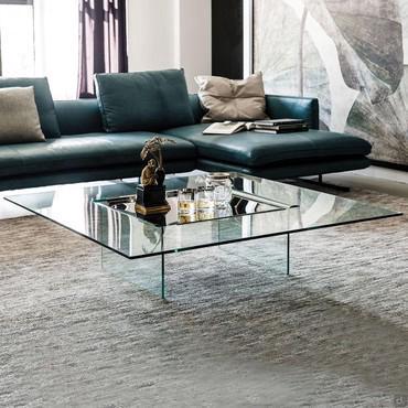 Carrè is a glass coffee table with metal tray by Cattelan that is useful set in front of the sofa 