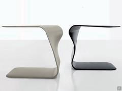 Duffy side tables with a distinctive sinuous shape, suitable as a sofa side or pouf