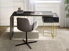 Brighton is a designer desk characterised by the contrast of materials between a black Ash-wood and some details in golden metal