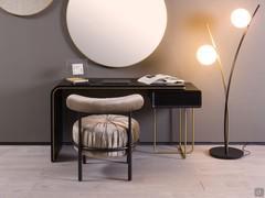 Brighton is a designer desk in black and gold matched with pouf  Bonbon, Half Moon mirror and Ophelia floor lamp