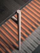 Detail of the painted metal tube that forms the 4-leg support structure of the Wright writing desk