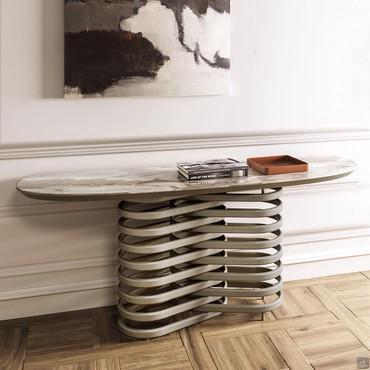 Vortex is a console table with metal ring base and top made of painted and hammered crystal, ceramic and marble