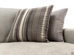 Cushions covered in Eiko Striped fabric and Eiko Geometric fabric