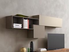 Fly wall units in matte lacquer with contrasting colors, combined with Cube shelves